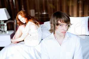 couple in disagreement in bedroom