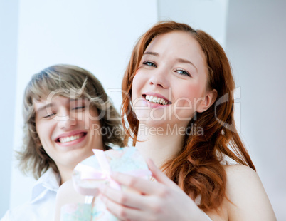 young couple with a gift