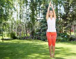 Young girl in a white shirt and red pants