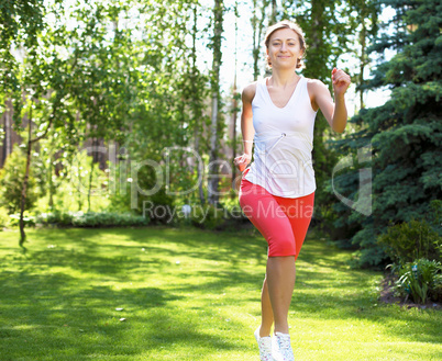 Young girl in a white shirt and red pants