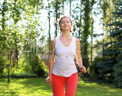 Young girl in a white shirt and red pants