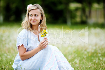 Young blond woman in the park