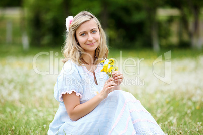 Young blond woman in the park