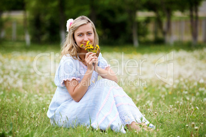 Young blond woman in the park