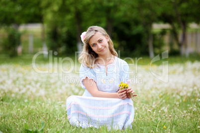 Young blond woman in the park