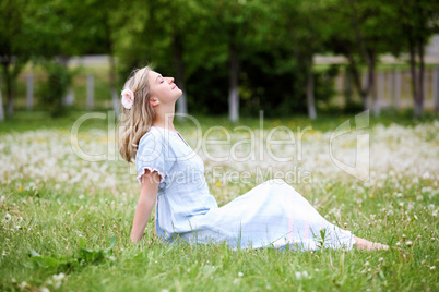 Young blond woman in the park