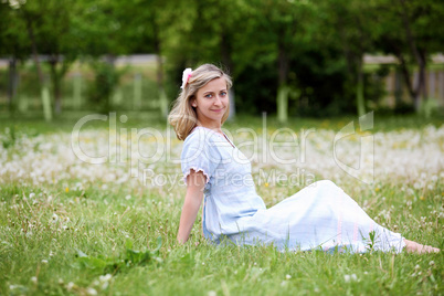 Young blond woman in the park