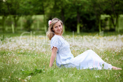 Young blond woman in the park