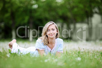 Young blond woman in the park