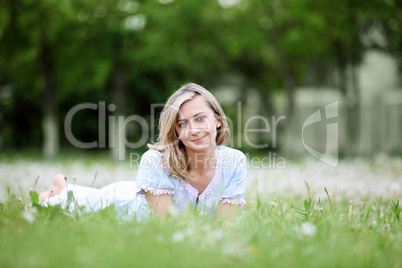 Young blond woman in the park