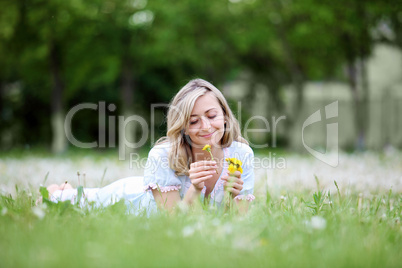 Young blond woman in the park