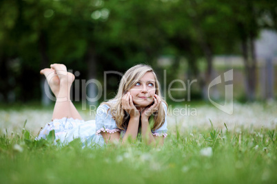 Young blond woman in the park