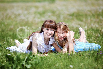 two girls playing in the park two girls playing in the park