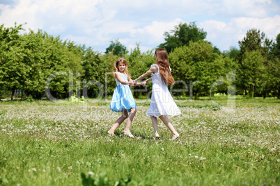 two girls playing in the park