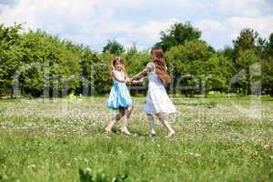 two girls playing in the park