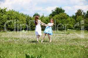 two girls playing in the park