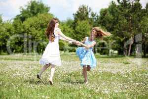 two girls playing in the park