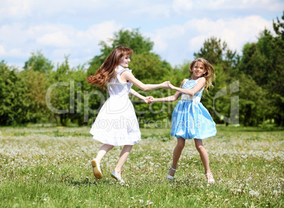 two girls playing in the park