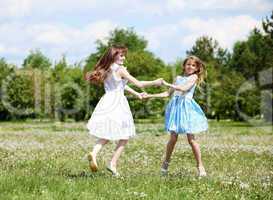 two girls playing in the park