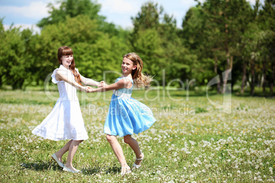 two girls playing in the park