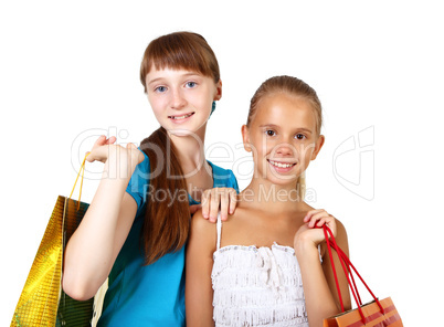 Pretty teenage girls with shopping bags