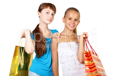 Pretty teenage girls with shopping bags