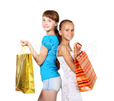 Pretty teenage girls with shopping bags