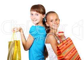 Pretty teenage girls with shopping bags