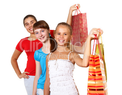 Pretty teenage girls with shopping bags