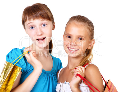 Pretty teenage girls with shopping bags