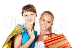 Pretty teenage girls with shopping bags