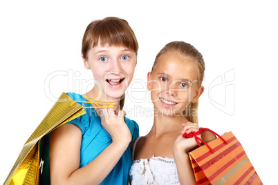 Pretty teenage girls with shopping bags