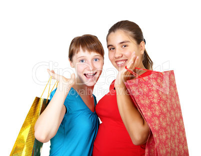 Pretty teenage girls with shopping bags