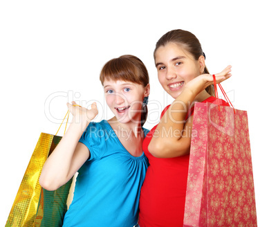 Pretty teenage girls with shopping bags