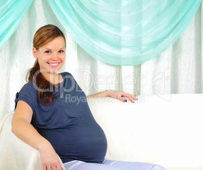 Portrait of a young pregnant girl