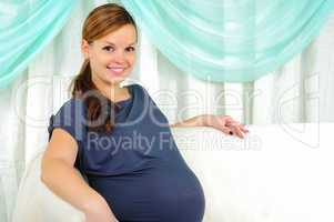 Portrait of a young pregnant girl