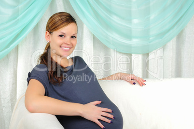 Portrait of a young pregnant girl