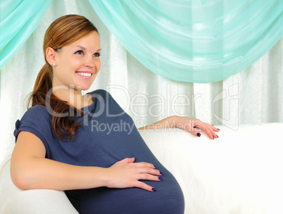 Portrait of a young pregnant girl