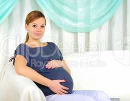 Portrait of a young pregnant girl