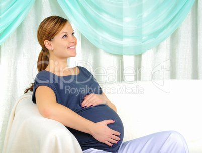 Portrait of a young pregnant girl