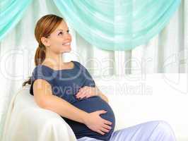 Portrait of a young pregnant girl