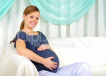 Portrait of a young pregnant girl