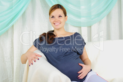 Portrait of a young pregnant girl