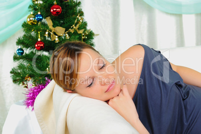 Pregnant woman lying on a sofa