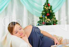 Pregnant woman lying on a sofa
