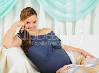 Portrait of a young pregnant girl