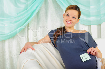 Portrait of a young pregnant girl