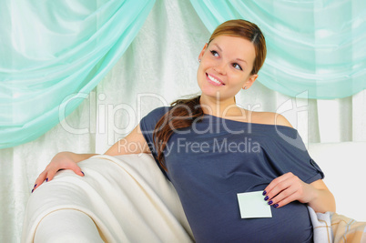 Portrait of a young pregnant girl