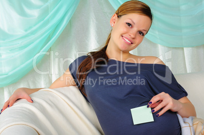 Portrait of a young pregnant girl