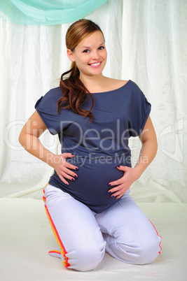 Portrait of a young pregnant girl